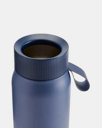 A 750 mL blue reusable insulated stainless steel bubble tea/ boba cup bottle by the brand Chillys.